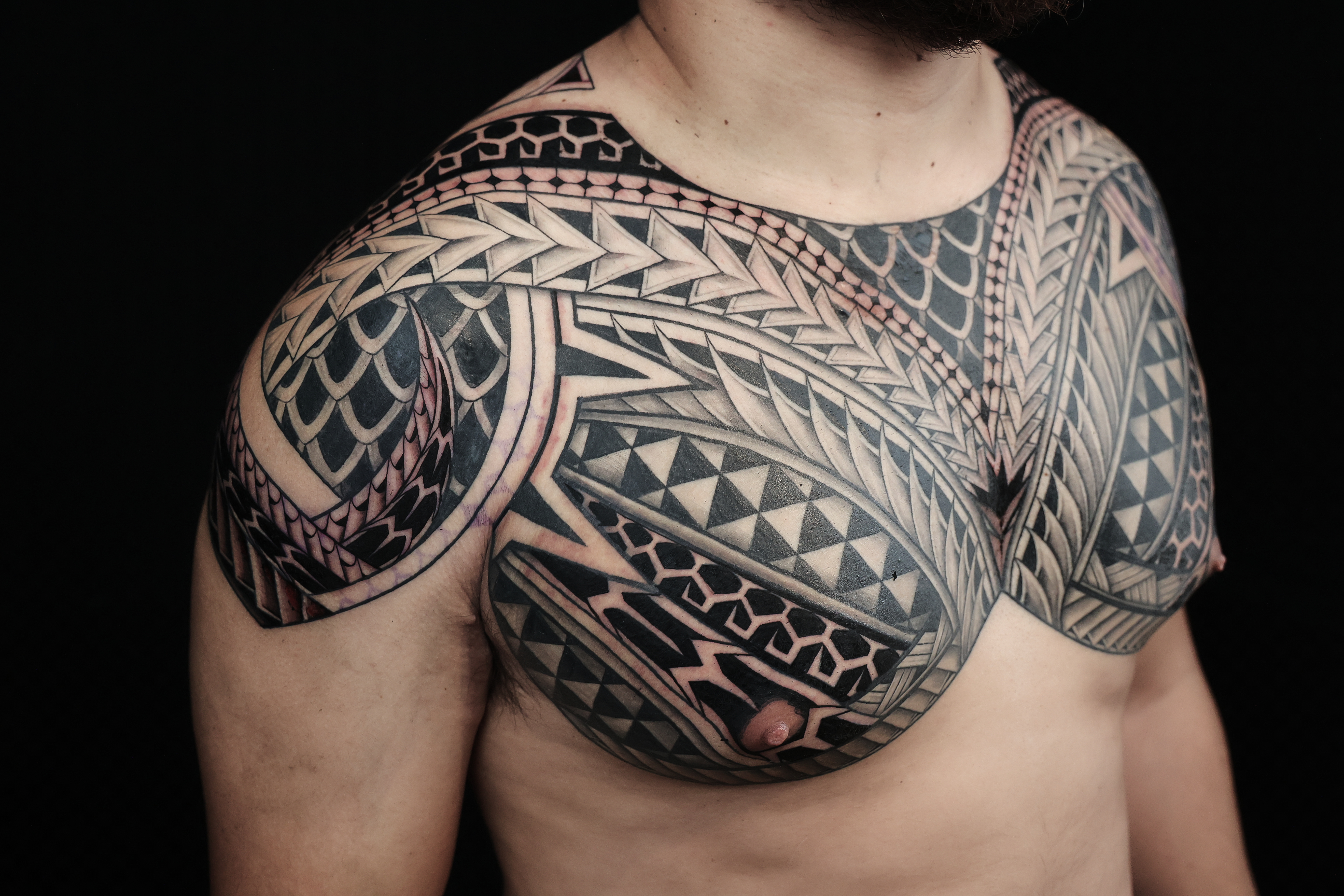 Polynesian chest pieces tattoo by Joshawa Elsas – IslandTAT San Diego