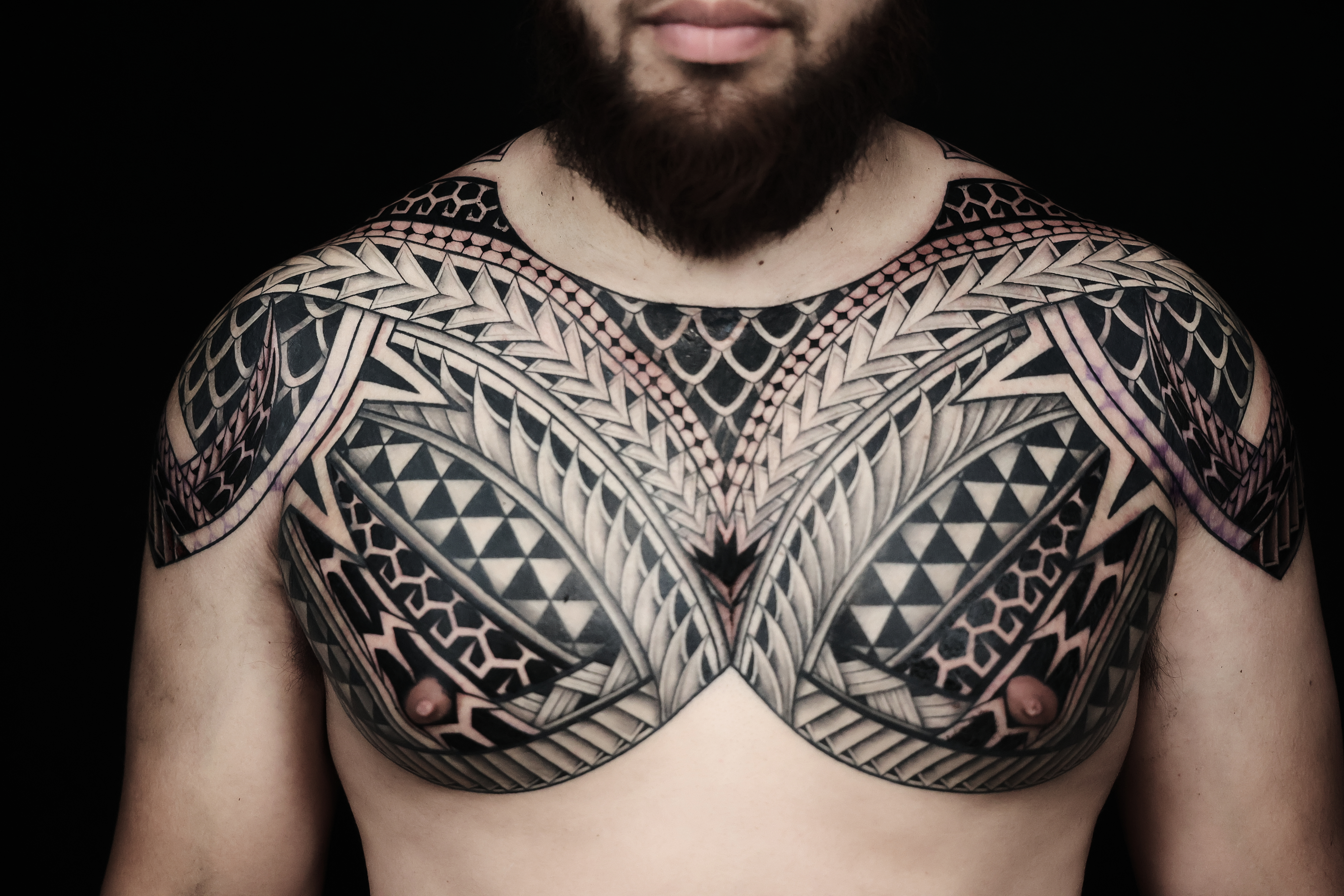 Polynesian chest pieces tattoo by Joshawa Elsas – IslandTAT San Diego