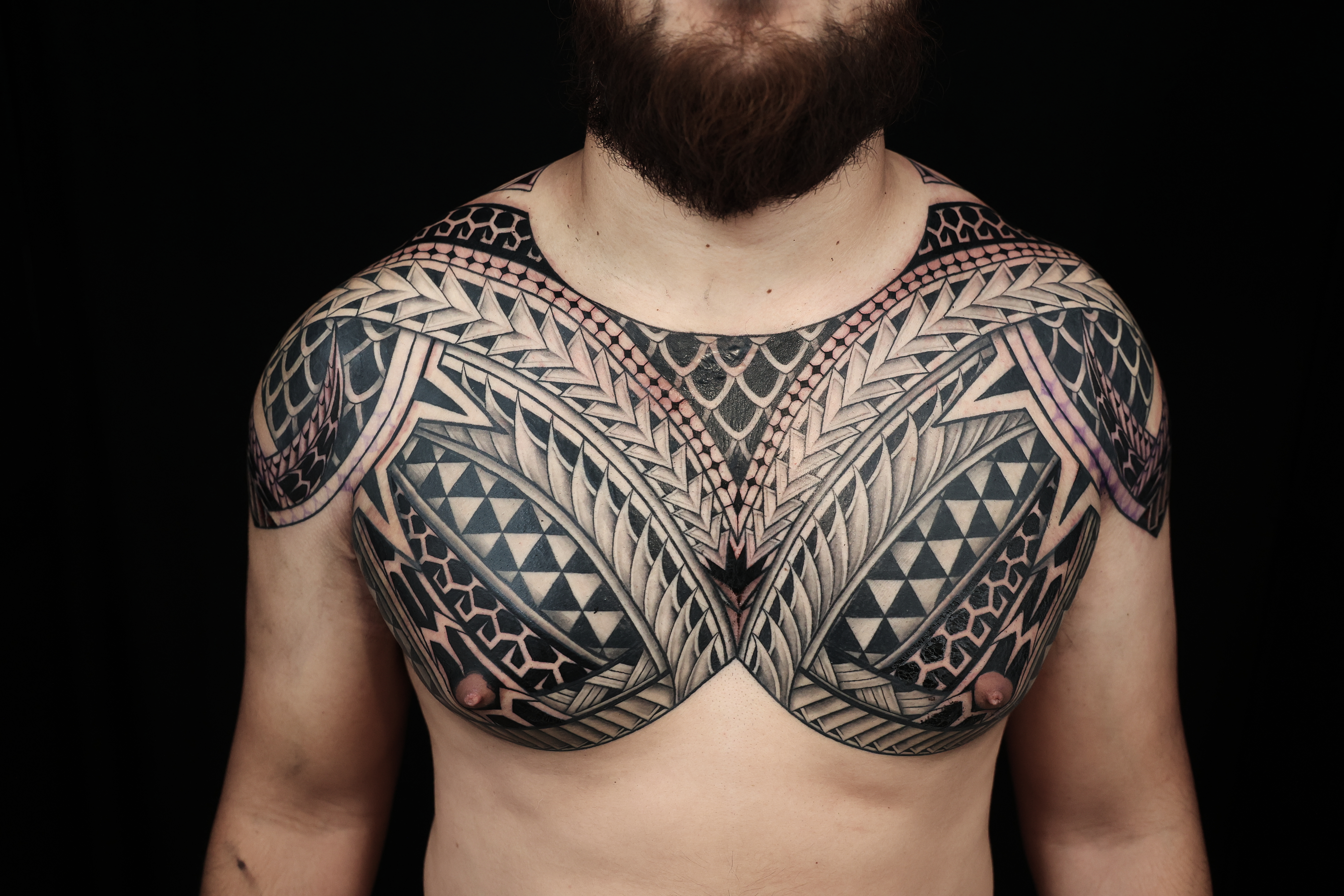 Polynesian chest pieces tattoo by Joshawa Elsas – IslandTAT San Diego